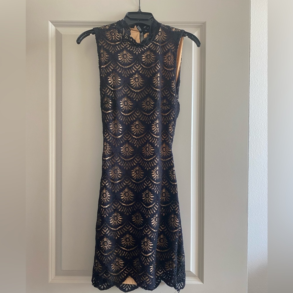 Brand new with tags!! Adorable, tight fitted, black lace dress
